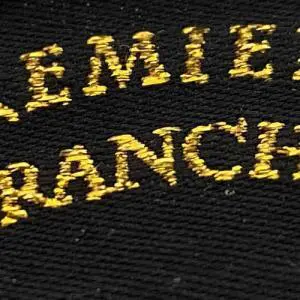 Gold Metallic Garn als gewebte Schrift